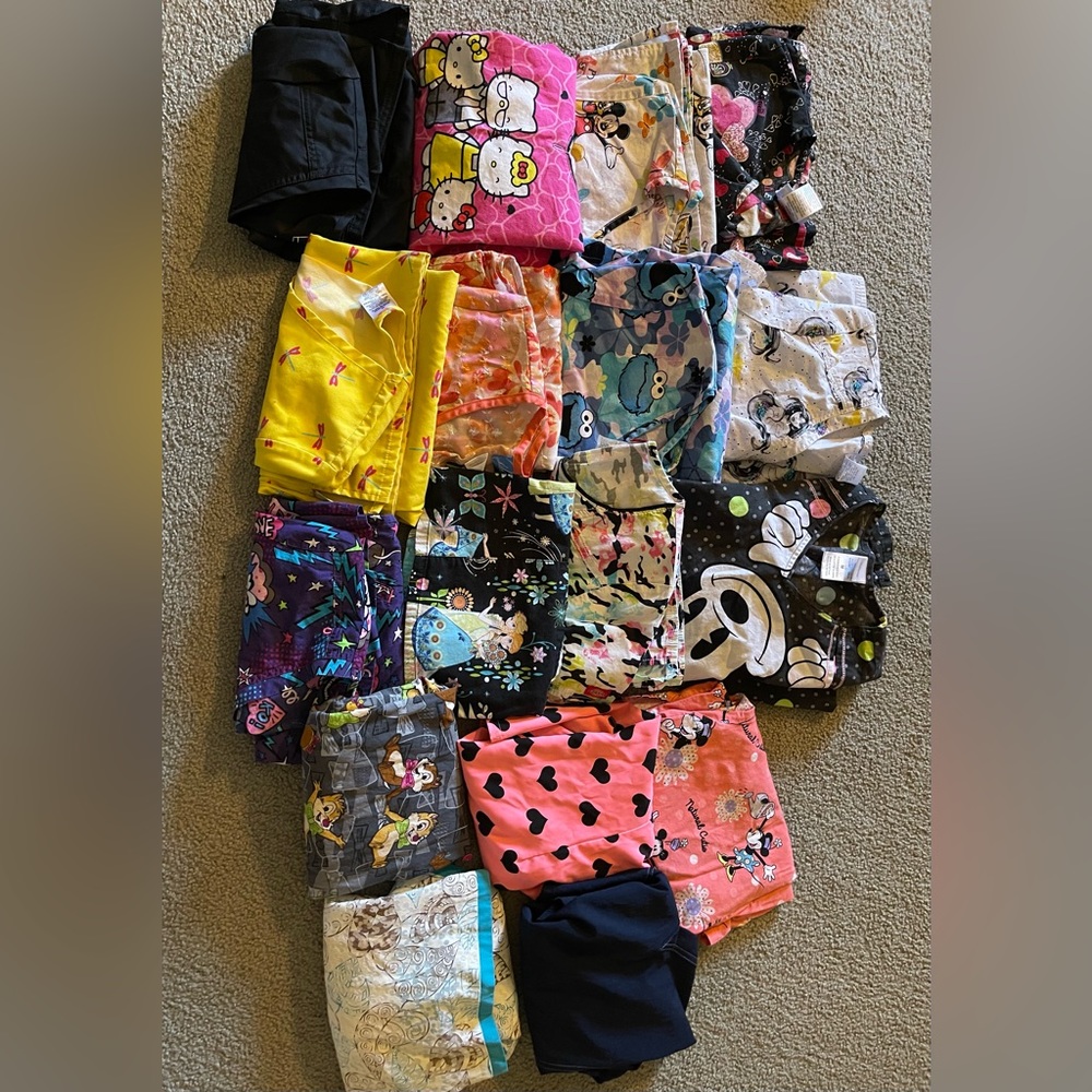 Scrub tops sizes ranging from small to meds
